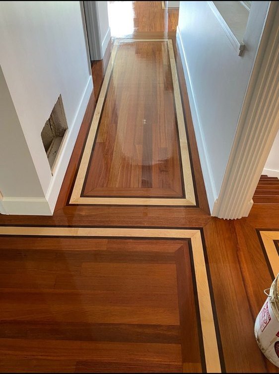 Inlaid hardwood floor in a hallway