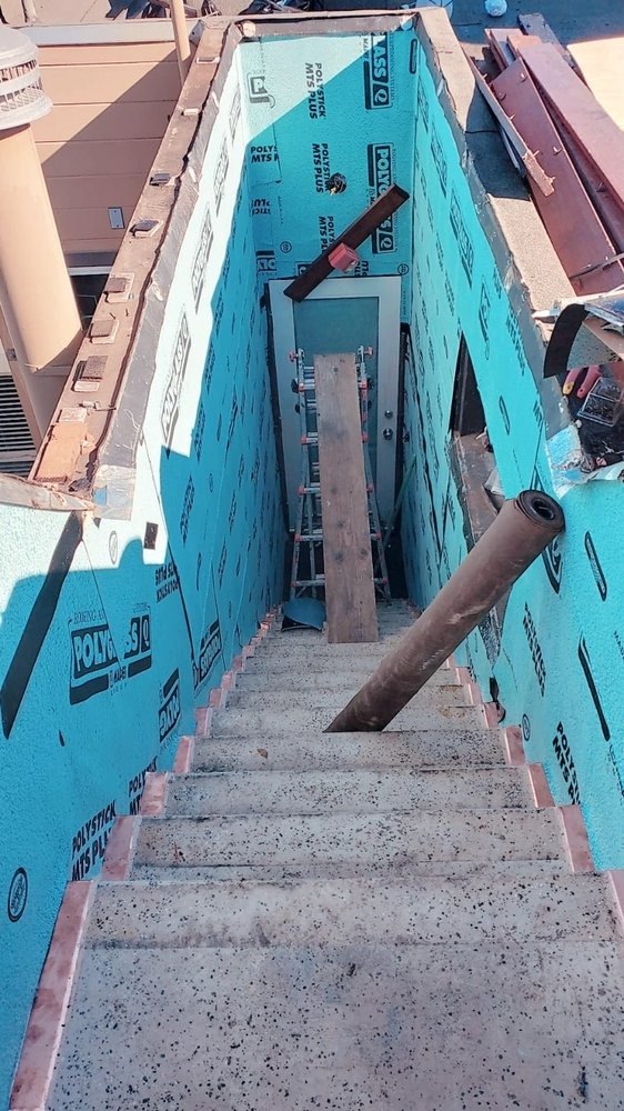 Waterproofed stairwell excavation with membrane on the walls