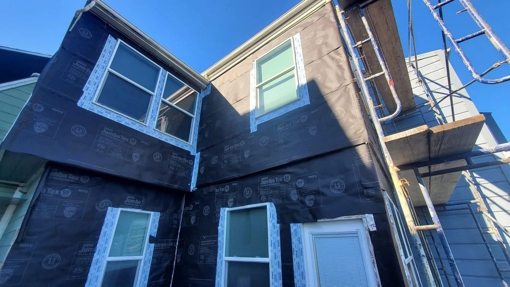 House exterior with weather barrier and new window frames